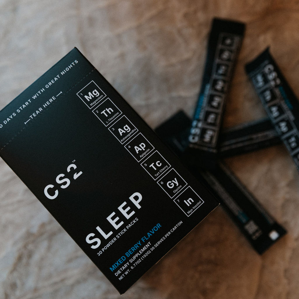 CS2 Sleep supplement packaging on a wooden surface