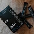 CS2 Sleep supplement packaging on a wooden surface